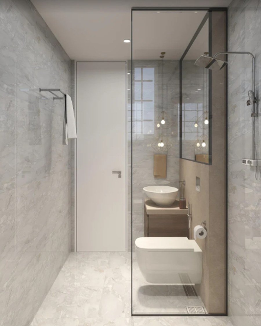 Narrow marble bathroom with round vessel basin and glass shower divider